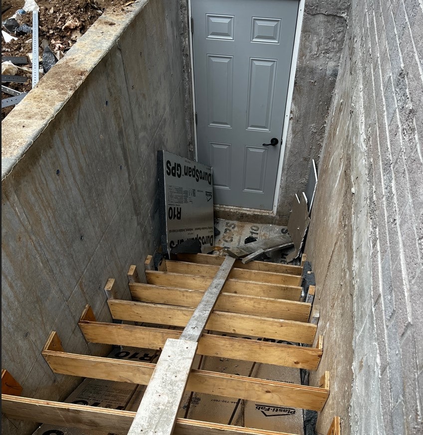 Construction process for basement walkout stairs with proper insulation used