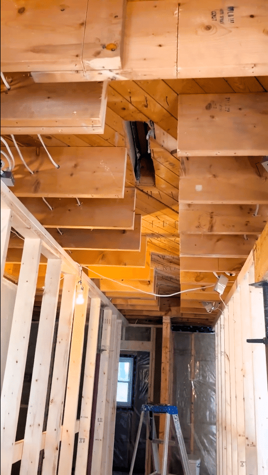 Ceiling Joists are cut back to accommodate new beam.